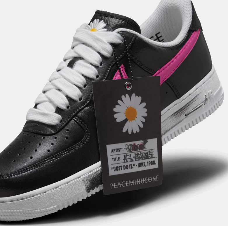 Nike Low-Top Sneakers – Black with Multicolor Swooshes & Daisy Details